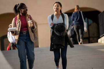 Students with back bags walk - ߣߣƵ University